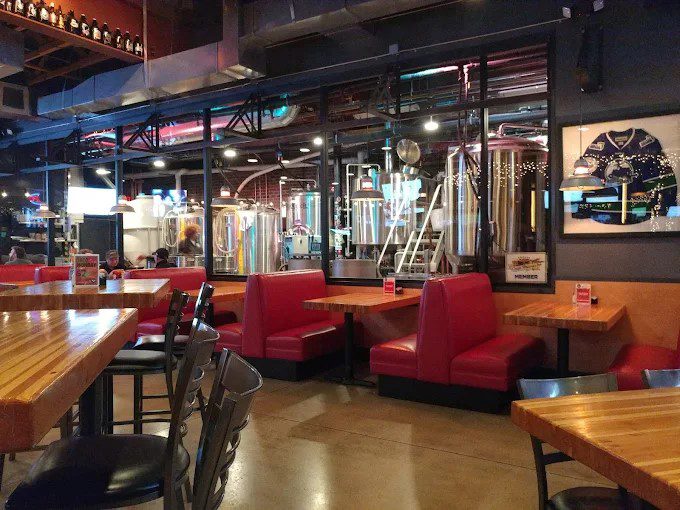 Brewery taproom bar with fermentation tanks