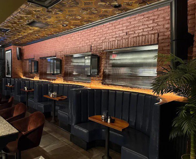 Decorative pressed-metal ceiling and metal-framed glass accents