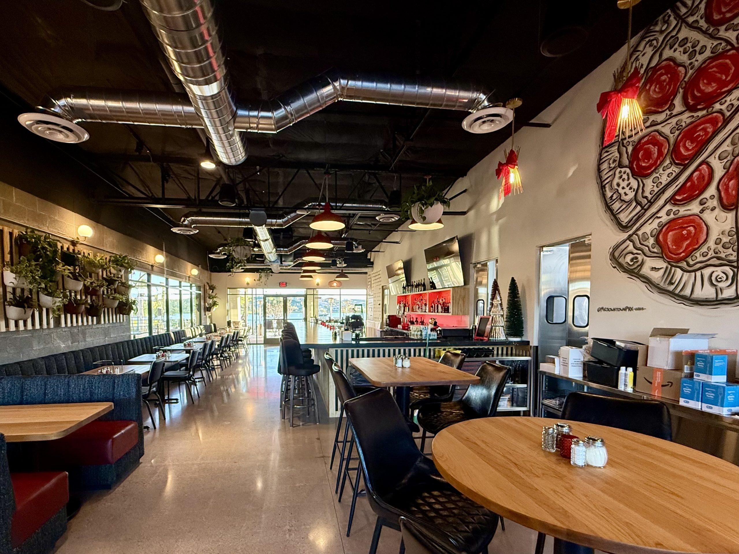 Tufted banquette, booths, slatted bar front and maple tables at Streets of New York Fountain Hills, by Lion Craft
